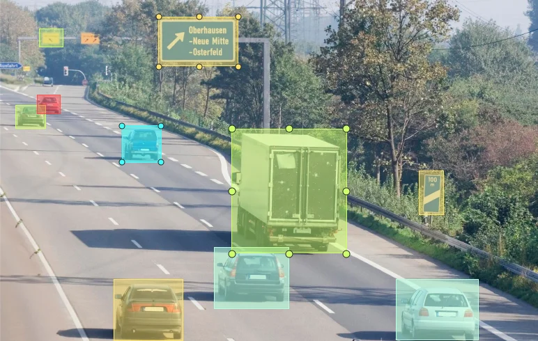 Highway scene with vehicles & signs in bounding boxes, showcasing Objectways’ image annotation for ADAS & automotive AI.