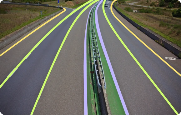 A highway with semantic segmentation of lanes, demonstrating data annotation for autonomous vehicles and ADAS.